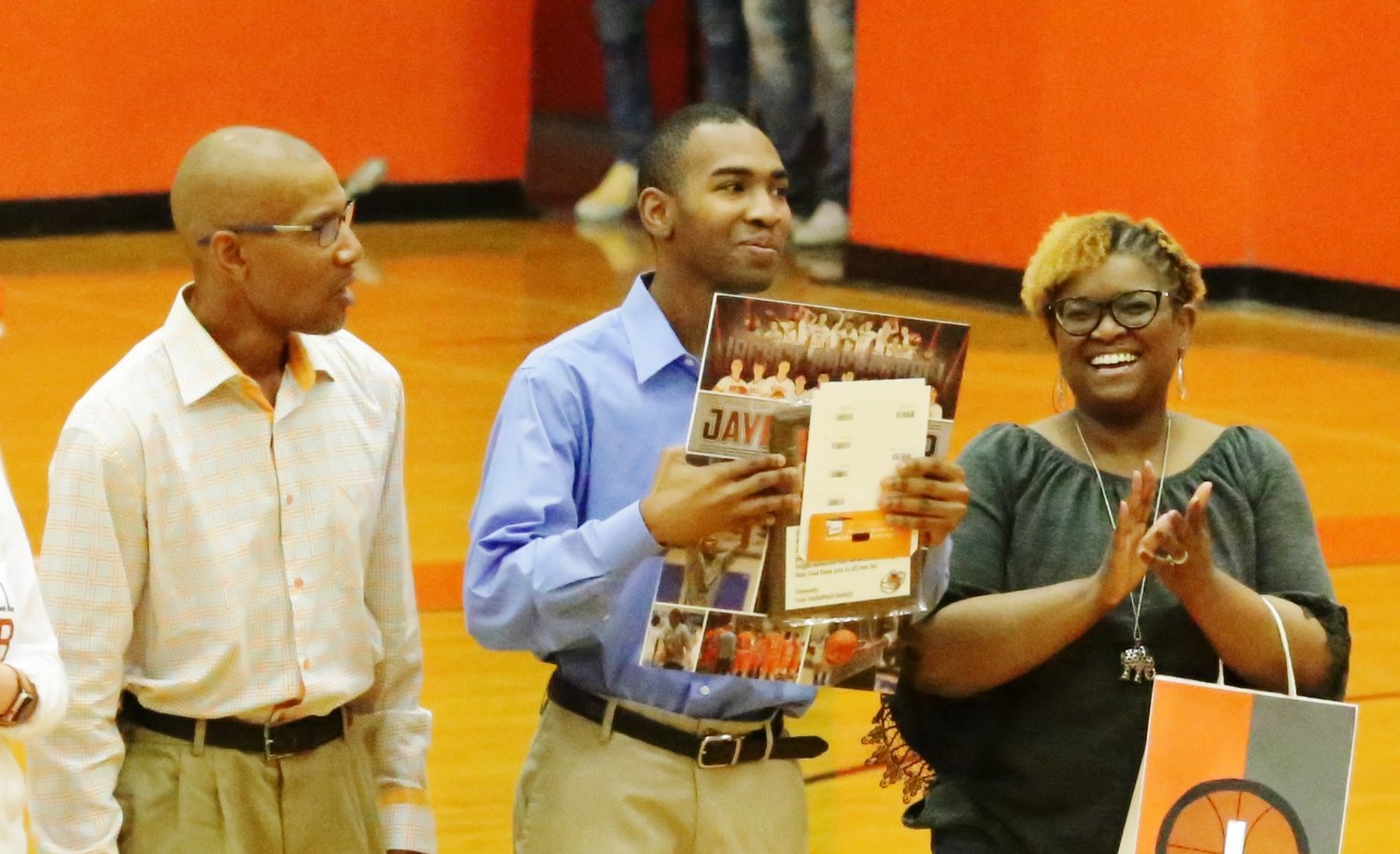 Jaylon Harper with his parents Toni and Royce Kennedy are recognized at last week’s senior night in Mineola.